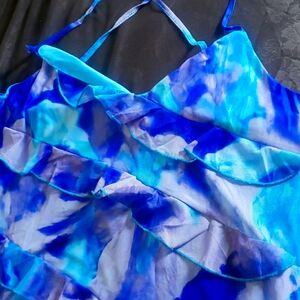 Multi blue dress with cute pleated fringes. Zipper on the side and criss cross